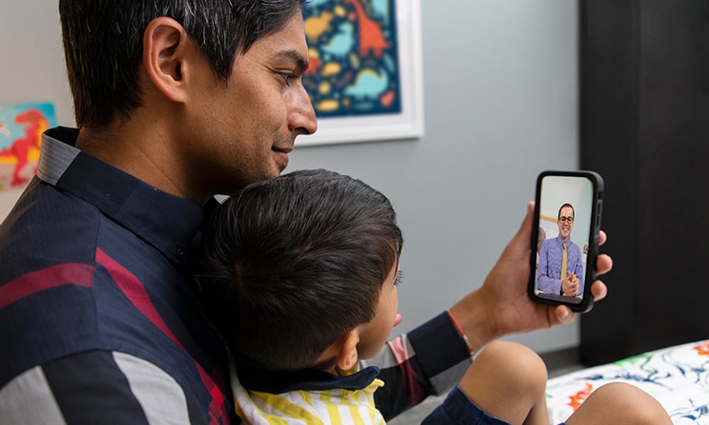 Parent and child on a telehealth appointment.