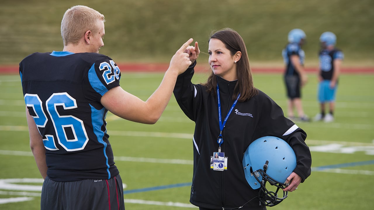 A Sports Medicine Center physician tests for concussion.